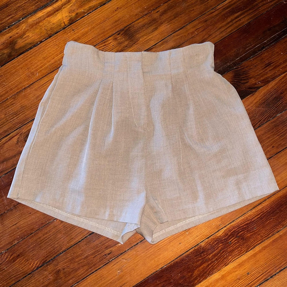 Women’s tan high waisted dress shorts with front zipper and two front pockets